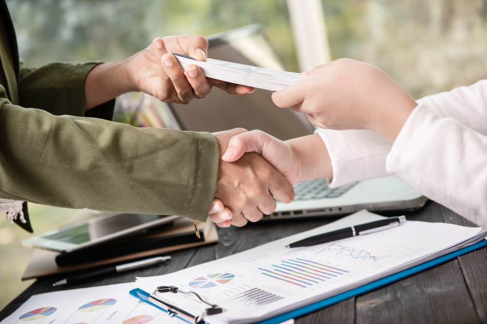 A person holding currency notes representing instant financial assistance through a personal loan